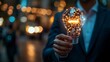 © Pat J. - Businessman with illuminated AI lightbulb, representing the impact of AI on future tech
