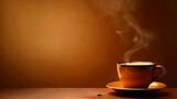 A close-up image of a steaming cup of coffee on a wooden table. The cup is brown and the background is a dark brown.