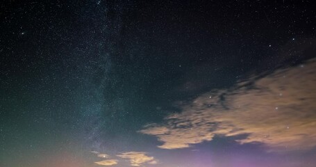 Wall Mural - background of milky way galaxy stars in starry night sky with clouds and colorful light of aurora bo
