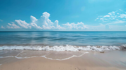 Wall Mural - Amazing view of the beach with white sand and blue water. The sky is blue and there are some clouds in the sky.