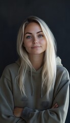 A woman with blonde hair and a hoodie sweatshirt