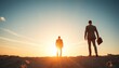 © CooLKenG - Businessmen Stand on Rocky Terrain, Watching the Sunset
