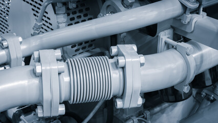 Aufkleber - A close up of a black engine with a white part. The engine is a large piece of machinery