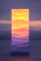 A vertical, glowing, abstract artwork depicting a sunset over mountains reflected in a lake.