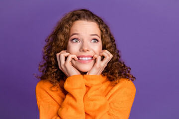 Portrait photo of wavy red hair young woman in orange stylish turtleneck always panic before tests isolated on violet color background