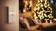 © Tino - a modern white light switch on warm beige wall, cozy contemporary living room, elegant Christmas tree with warm lighting in background, plush neutral sofa
