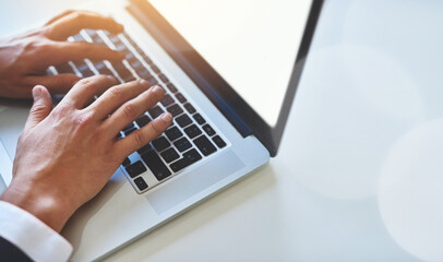 Hands, laptop or businessman typing email, sales report or research online. Computer, keyboard or fingers writing review closeup at desk for financial proposal or planning project on screen in office