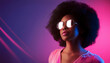 © marcelinopozo - A woman with a big afro is wearing sunglasses and a striped shirt on a pink and blue background.