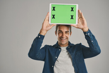 Aufkleber - Portrait, green screen and man with tablet, excited and happy person on gray studio background. Face, guy or model with tech, tracking markers or connection with internet, digital app or website info