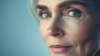 © Horizen - Captivating portrait of a mature woman with expressive blue eyes and thoughtful expression