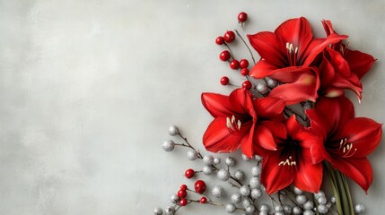 Poster - A vibrant bouquet of red flowers accompanied by silver berries is elegantly arranged on a soft gray backdrop, perfect for seasonal decorations or festive celebrations.