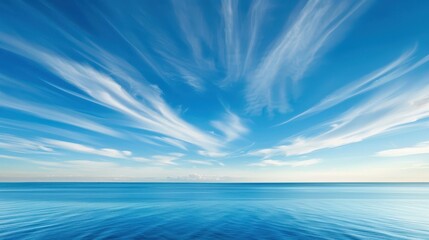 Wall Mural - Experience the serene beauty of a vast blue sky adorned with fluffy white clouds, a perfect backdrop for all seasons.
