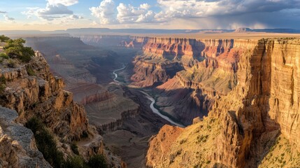 A dramatic canyon landscape with steep cliffs and a river winding