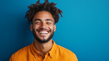 Portrait of a happy handsome man in a shirt with laughing