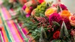 © Lasvu - Vibrant floral arrangement and small trees on a striped holiday table display