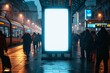 © apk - Vertical Advertising Billboard with Blank White Poster on Crowded Train Station Platform at Night