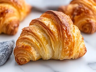 The croissant flaky and buttery, with a perfectly crisp exterior and a soft, layered interior.