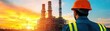 © Cherrin - A worker in a hard hat observes industrial towers against a vibrant sunset, highlighting the energy sector's impact on nature.