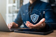 © Thapana_Studio - Cyber ​​security and internet data protection, businessman using laptop and tablet with padlock icon encryption security protect business and financial data, cloud computing security.