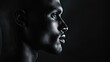 © Mehemmed - Solid black sporty male head with a slim rectangle nose, highlighted against a dark background, emphasizes the unique features of this sporty male head for creative needs. Copy space available.