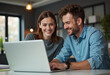 © ON - Studio - Two friends enjoy a productive afternoon working together on a laptop in a cozy modern workspace