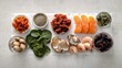 © KYR - Spread of foods rich in essential minerals, including dried fruits, shellfish, and spinach, arranged on white paper with a balanced layout.