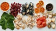 © KYR - Spread of foods rich in essential minerals, including dried fruits, shellfish, and spinach, arranged on white paper with a balanced layout.
