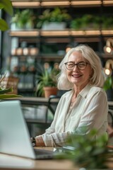 Wall Mural - A woman smiles as she works on her laptop. AI.