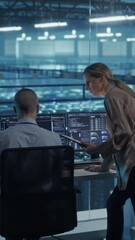 Poster - Vertical Screen: Team of Developers Working on Computers in a Modern Office in a Data Center Facility. Team Analyzing Data and Optimizing Systems. Female Manager Having a Conversation with a Colleague