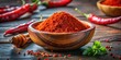 © Sandra - An up-close look at rich, vibrant red ground paprika in a wooden bowl, ideal for adding depth and color to diverse culinary creations and recipes.