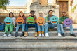 © Lomb - Diverse group of young friends showing social media emotions with colorful emoji signs