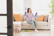 © deagreez - Full body photo of nice young teen girl mopping floor detergent wear violet clothes enjoy modern cozy bright interior flat indoors