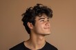 © Vlad - Looking Side. Young Brazilian Man Model Smiling and Attractive, Isolated on Beige Background