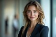 © Imagentive - Professional Woman with Bright Smile and Wavy Hair in Business Attire