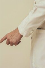 Poster - A man in a white coat pointing at something, possibly important or interesting