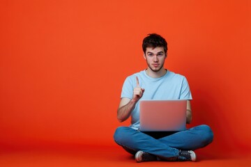 A person sitting on the floor with a laptop, perfect for remote work or study