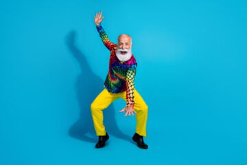 Full size photo of funky old man have fun dancing dressed colorful disco outfit isolated on blue color background