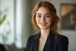 © Imagentive - Smiling Businesswoman with Wavy Hair in Blazer - Relaxed