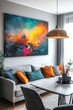 © vefimov - A stylish modern living room with vibrant abstract art on the wall, a neutral couch adorned with bright pillows, and contemporary furniture arranged for comfort.
