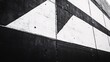 © mifta - A black and white painted concrete wall with geometric patterns.