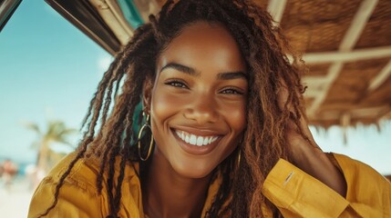 A woman wearing a yellow shirt with natural hair smiles brightly while outside, conveying a sense of joy and relaxation amidst a sunny, vibrant day.