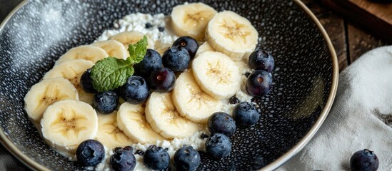 Canvas Print - Bananas With Blueberries Cottage Cheese And Raisins Slices In A Plate Appetizing Bananas With Black Berries