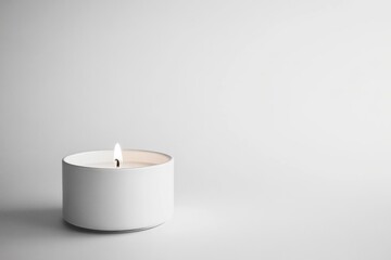 Poster - A single white candle burning on a white surface.