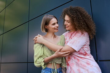 A lovely couple enjoys a warm embrace and joyful moments outdoors together.