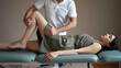 © Guddah - Physiotherapist giving treatment to a patient