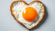 © Your Hand Please - heart-shaped fried egg sits on a colorful backdrop, symbolizing love and warmth. This playful, cheerful image evokes feelings of joy, comfort, and a fresh start to the day