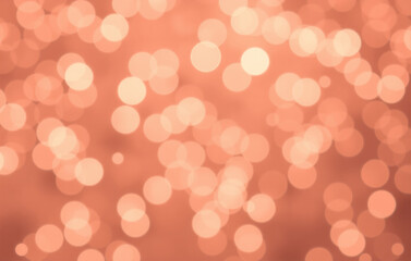 Rose gold bokeh background with soft pink and coppery lights