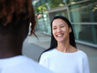 © Austockphoto - man standing in the street with an Asian woman smiling at him