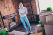 © deagreez - Full body photo of nice young girl crossed hands confident wear jeans shirt enjoy relocation move new modern cozy interior flat indoors
