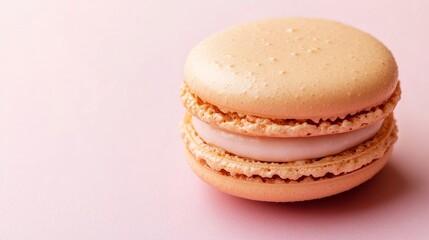 Delicate Single Macaron on Pastel Background with Negative Space for Copy.